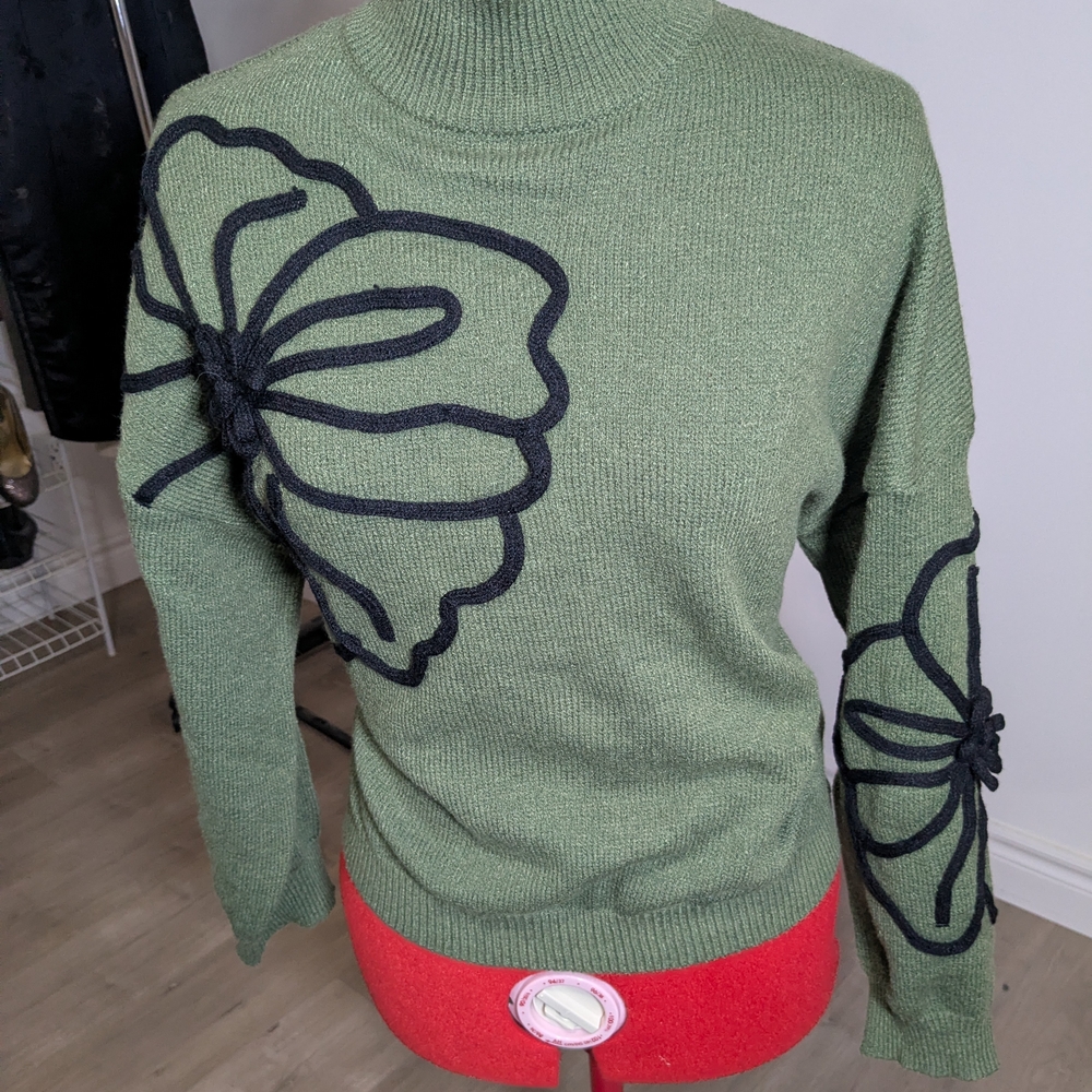 Green Sweater with Black Floral Design